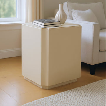white brushed accent table in a contemporary cozy bedroom setting