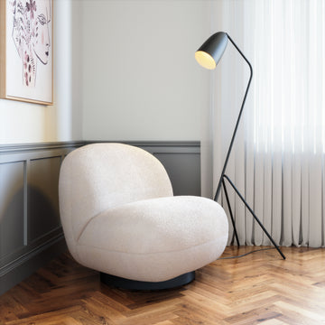 warm-toned soft accent chair in a contemporary cozy bedroom setting